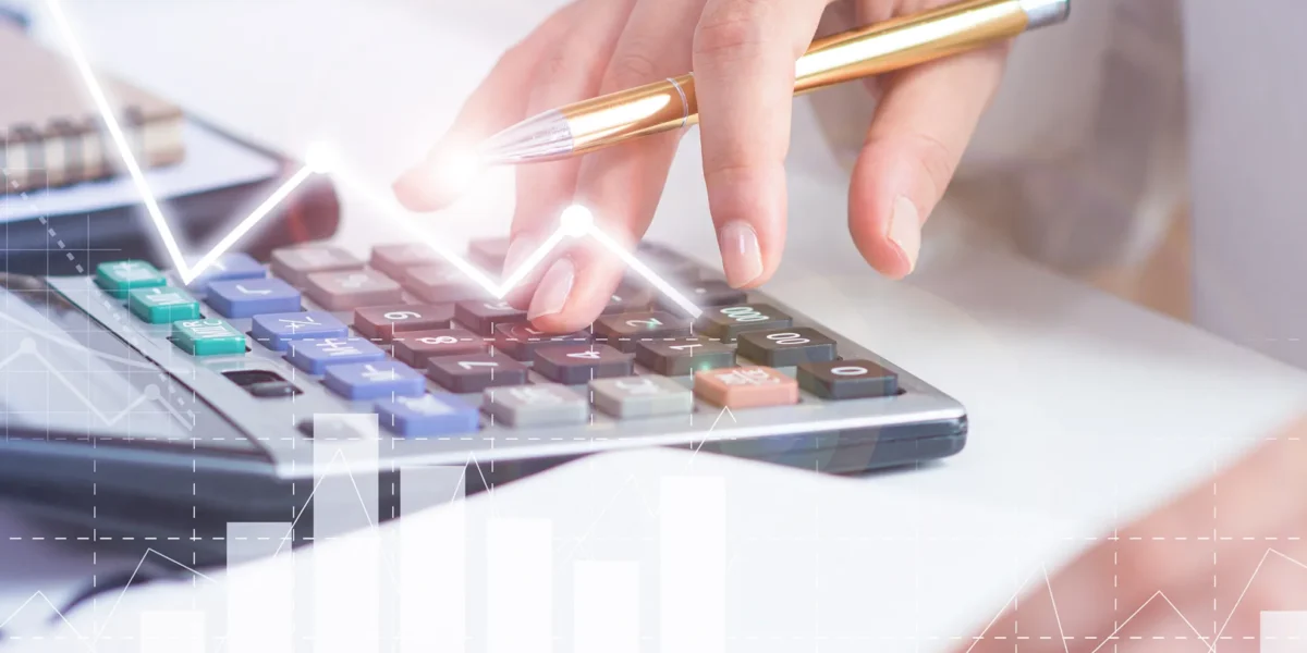 accountant-calculating-profit-with-financial-analysis-graphs 1