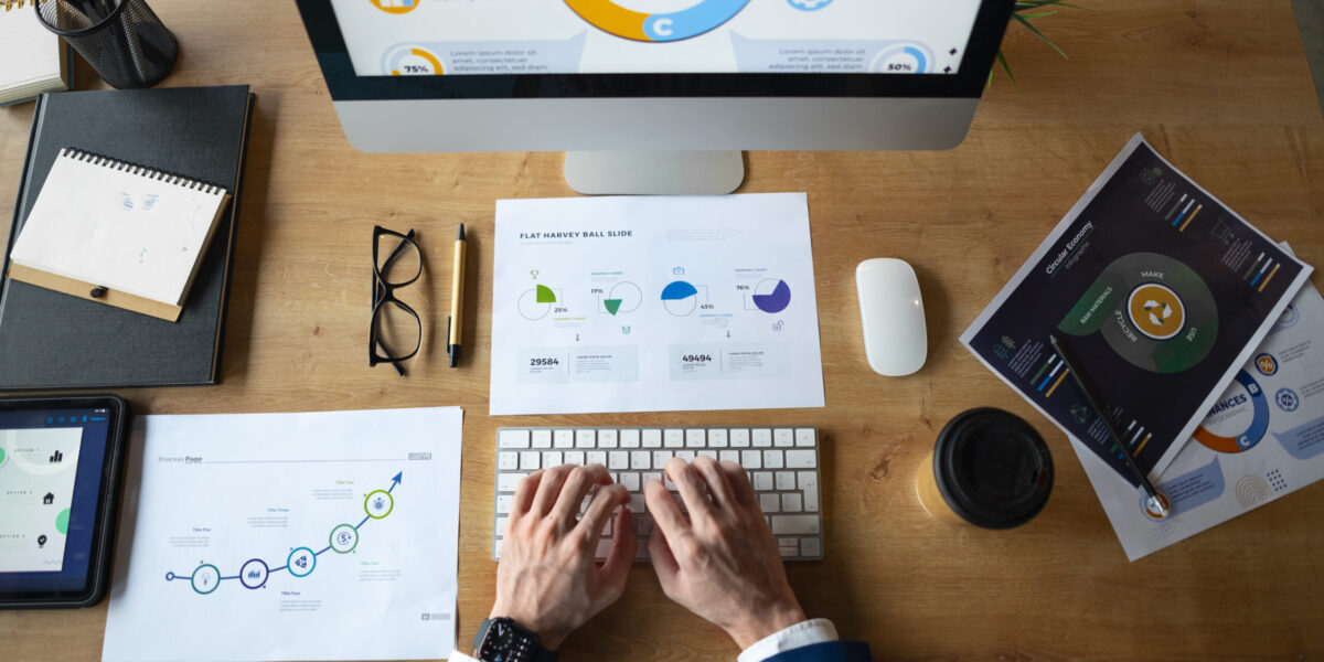person-office-analyzing-checking-finance-graphs (1)