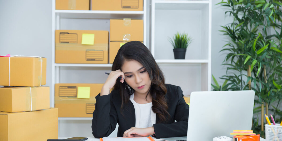 business owner working at home office packaging on background. online shopping SME entrepreneur working Young Women happy after new order from customer.