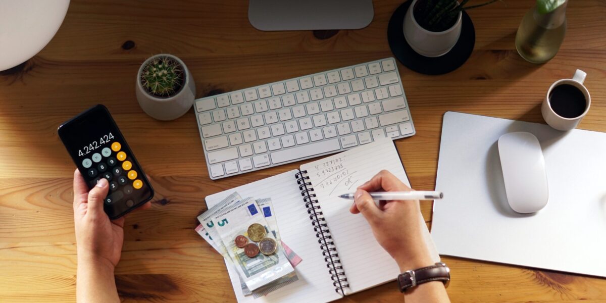 A closeup shot of an entrepreneur working from home on his personal finances and savings