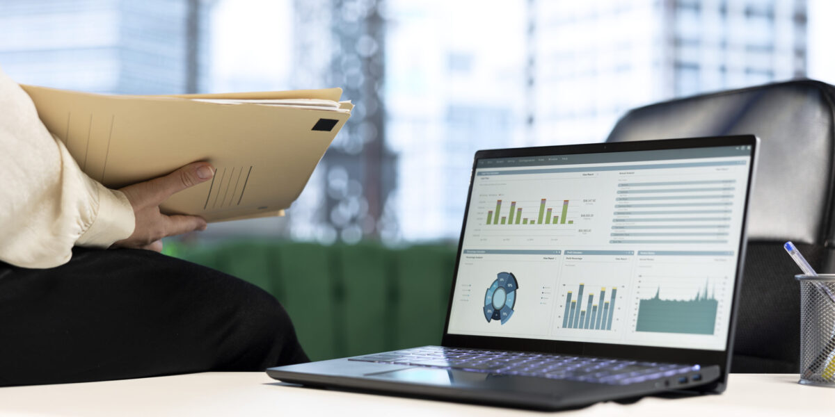 Empowered female CEO working in her high end corporate office, focusing on career development and maintaining a productive goal oriented work environment. Strategic thinking for growth. Close up.