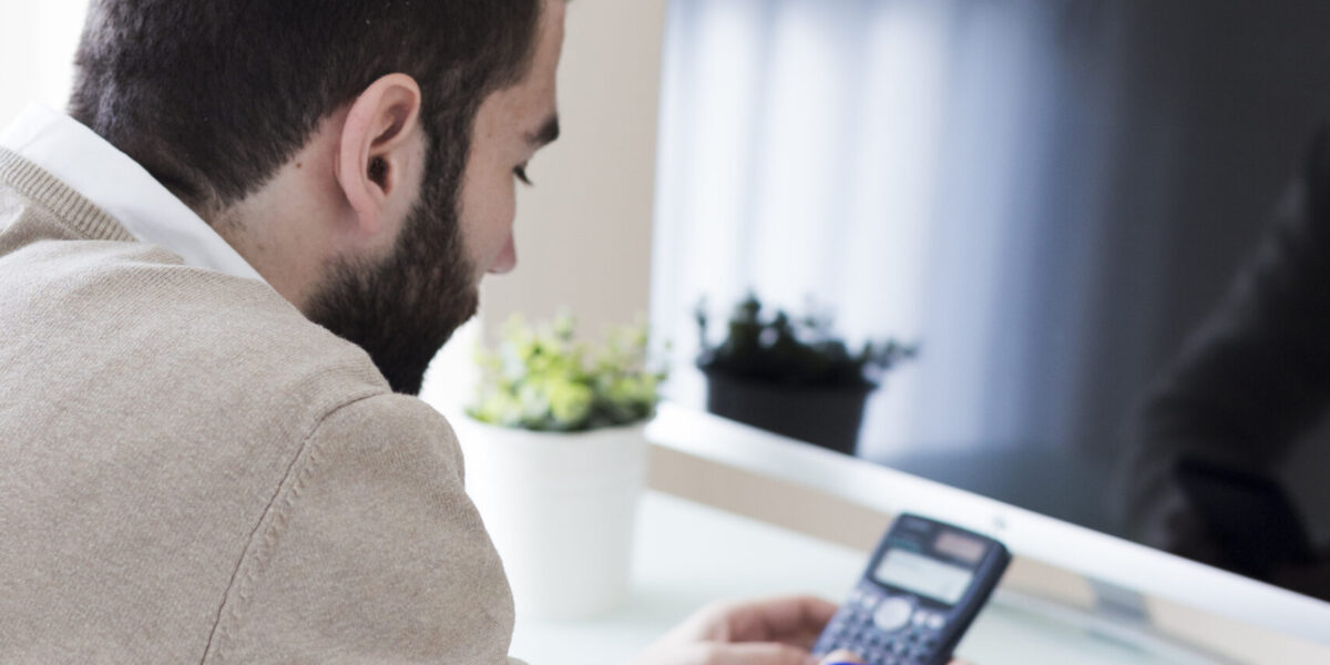 man-making-calculations-office