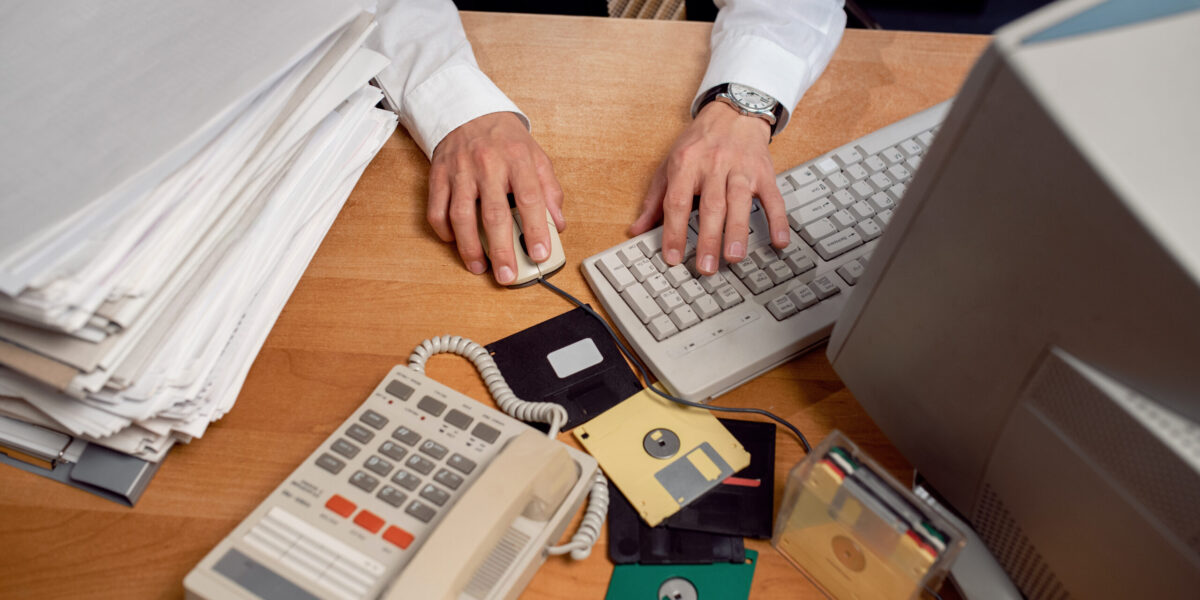 vintage-90-s-style-office-with-person-working-desk